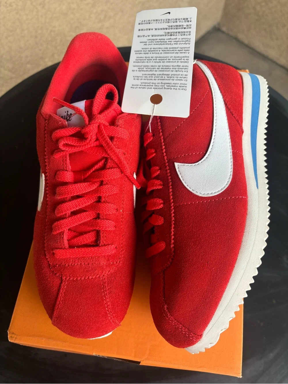 Nike women’s Red Suede Athletic Sneakers with White Swoosh